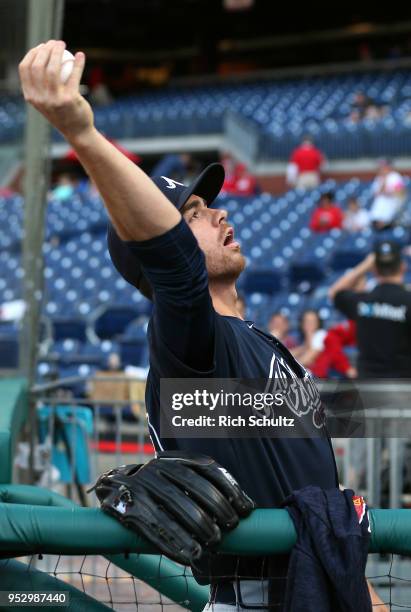 Jesse Biddle of the Atlanta Braves tosses an autographed ball to a fan before a game against the Philadelphia Phillies at Citizens Bank Park on April...