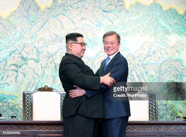 North Korean leader Kim Jong Un and South Korean President Moon Jae-in embrace after signing the Panmunjom Declaration for Peace, Prosperity and...