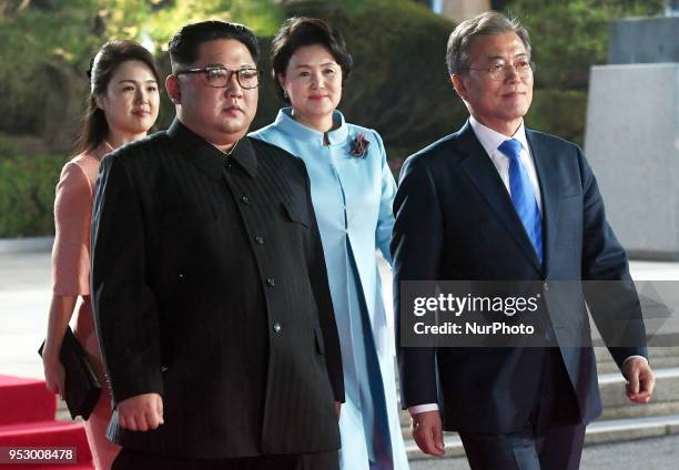 North Korea's leader Kim Jong Un and his wife Ri Sol Ju walk with South Korea's President Moon Jae-in and his wife Kim Jung-sook during a farewell...