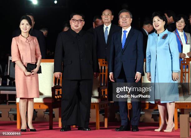 North Korea's leader Kim Jong Un and his wife Ri Sol Ju walk with South Korea's President Moon Jae-in and his wife Kim Jung-sook during a farewell...