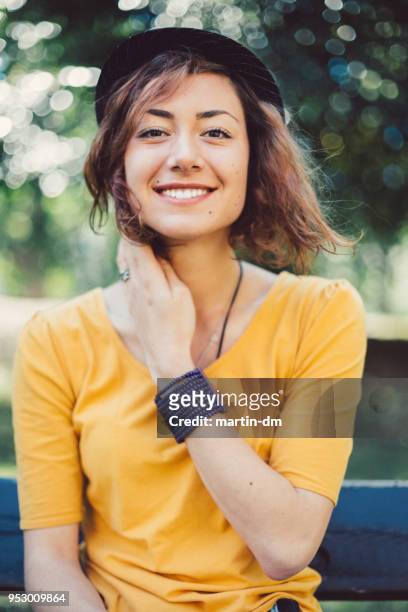 smiling woman's portrait - tossing hair facing camera woman outdoors stock pictures, royalty-free photos & images