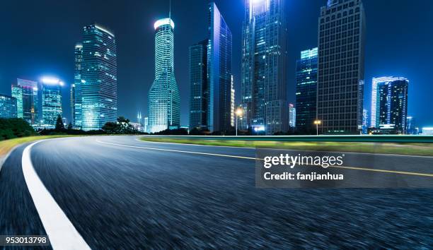 modern office buildings group by empty road,shanghai - empty road stock pictures, royalty-free photos & images