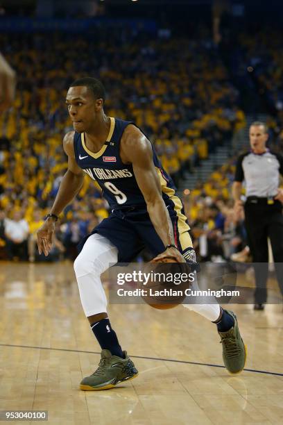 Rajon Rondo of the New Orleans Pelicans dribbles the ball during Game One of the Western Conference Semifinals against the Golden State Warriors at...