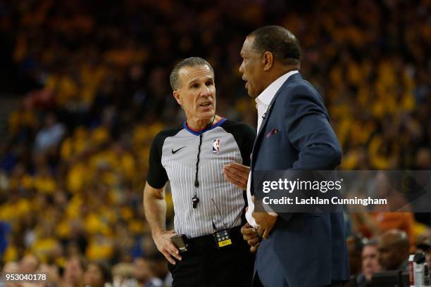 Referee Ken Mauer speaks with with New Orleans Pelicans head coach Alvin Gentry during Game One of the Western Conference Semifinals at ORACLE Arena...