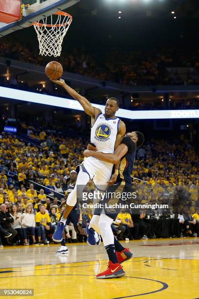 Andre Iguodala of the Golden State Warriors is intentionally fouled by Anthony Davis of the New Orleans Pelicans during Game One of the Western...