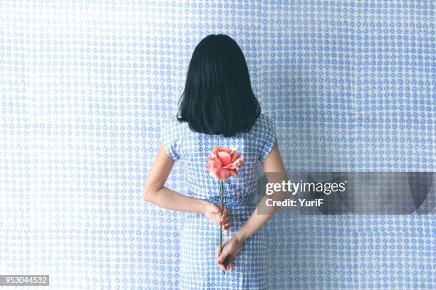 woman in blue - flower presents ストックフォトと画像