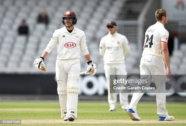 Rory Burns of Surrey holds his bat after it broke in half while playing a shot during day four of the Specsavers County Championship Division One...