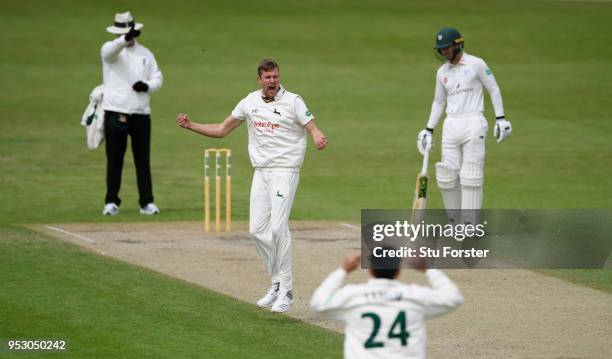 Notts bowler Jake Ball celebrates as umpire Richard Illingworth sends Worcestershire batsman Travis Head on his way for 29 runs during day four of...