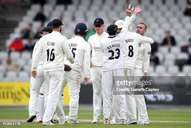 Liam Livingstone of Lancashire celebrates with teammates after dismissing Rory Burns of Surrey during day four of the Specsavers County Championship...