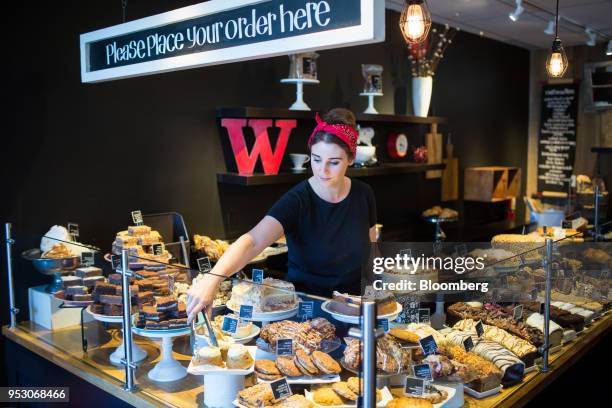 An employee arranges pastries at a Purebread bakery in Whistler, British Columbia, Canada, on Friday, April 27, 2018. The cost of a typical home in...