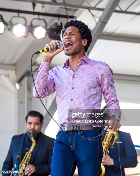 Jon Batiste performs during the New Orleans Jazz & Heritage Festival at Fair Grounds Race Course on April 29, 2018 in New Orleans, Louisiana.