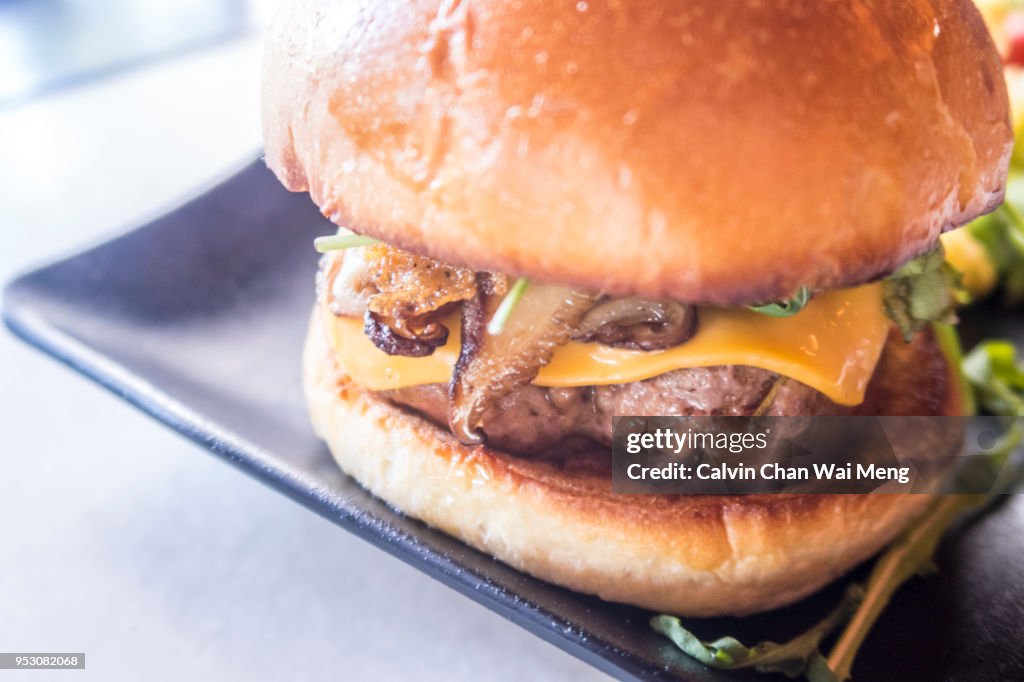 Cheese and mushroom beef burger with bun