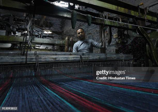 Surender Gupta, owner of Shankar Woollen Mill , on April 19, 2018 in Panipat, India. Explaining the process of making these blankets, he said once...