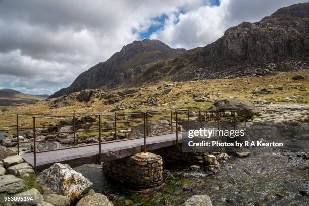 footbridge at cwm idwal, snowdonia national park, north wales - capel curig stock pictures, royalty-free photos & images