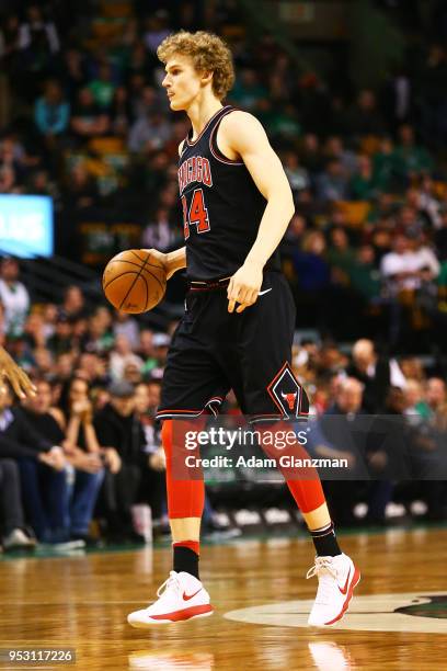 Lauri Markkanen of the Chicago Bulls dribbles the ball during a game against the Boston Celtics at TD Garden on April 6, 2018 in Boston,...