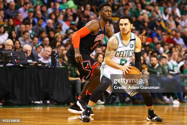 Shane Larkin of the Boston Celtics is guided by Bobby Portis of the Chicago Bulls during a game at TD Garden on April 6, 2018 in Boston,...