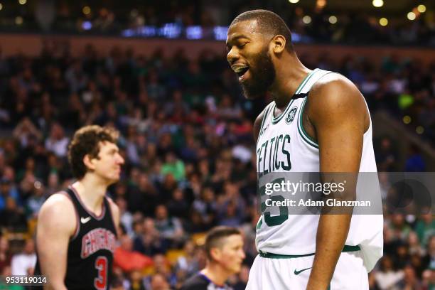 Greg Monroe of the Boston Celtics reacts after being fouled by Omer Asik of the Chicago Bulls during a game at TD Garden on April 6, 2018 in Boston,...