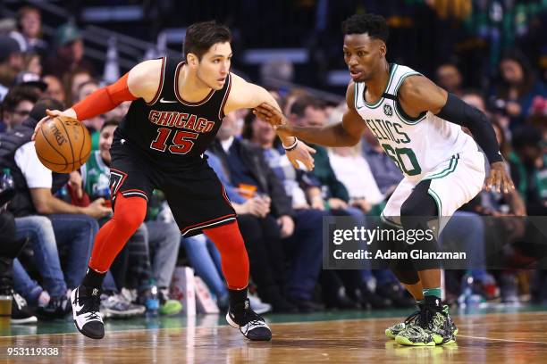 Jonathan Gibson of the Boston Celtics guards Ryan Arcidiacono of the Chicago Bulls during a game at TD Garden on April 6, 2018 in Boston,...