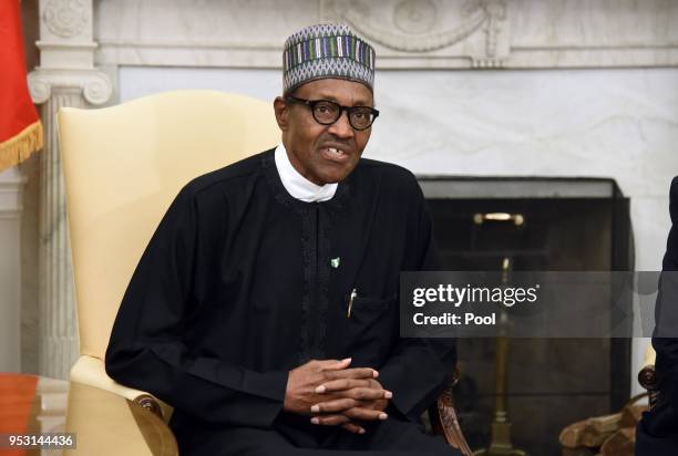 Nigerian President Muhammadu Buhari speaks during a meeting with US President Donald Trump in the Oval Office of the White House on April 30, 2018 in...