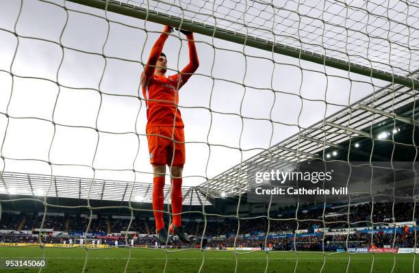 Thibaut Courtois jumps up to the crossbar during the Premier League match between Swansea City and Chelsea at Liberty Stadium on April 28, 2018 in...