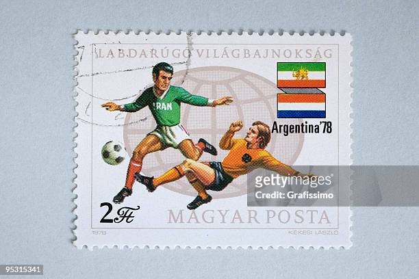 bildbanksillustrationer, clip art samt tecknat material och ikoner med close up of hungarian post stamp showing soccer players - 1978