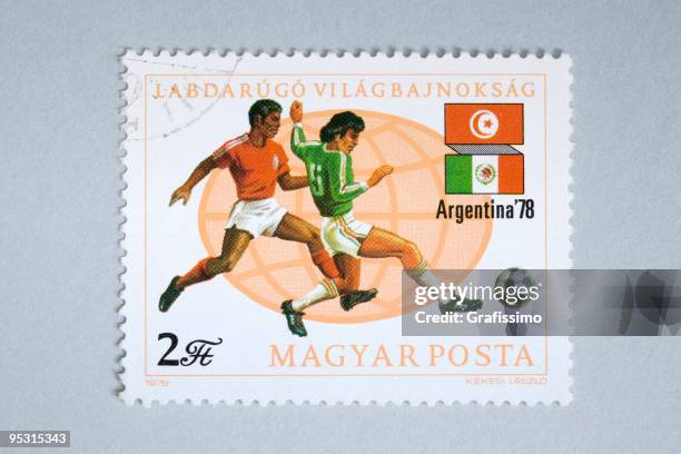 close up of hungarian post stamp showing soccer players - 1978 2008 stock illustrations
