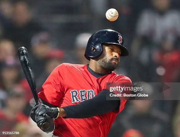 Boston Red Sox player Jackie Bradley Jr. Fouls a ball in the fifth inning that bounces above him. The Boston Red Sox host the Tampa Bay Rays in a...