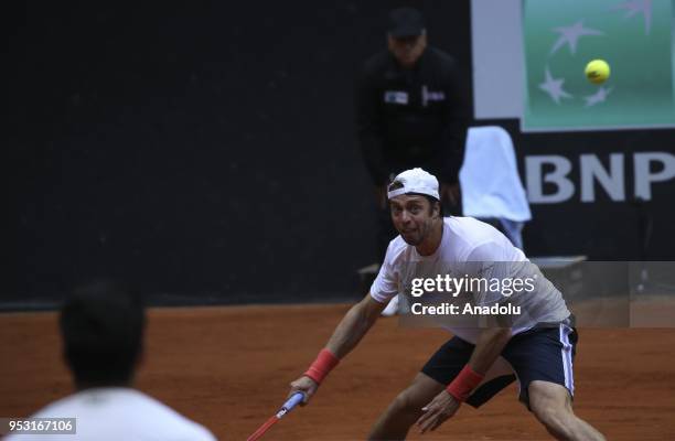 Paolo Lorenzi of Italy in action against Cem Ilkel of Turkey during the TEB BNP Paribas Istanbul Cup men's singles tennis match at the Garanti Koza...