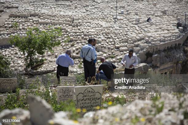 Palestinians gather to protest Israeli attacks on Babu'r Rahme Cemetery near the Masjid al-Aqsa in Jerusalem on April 20, 2018. Israeli officials had...