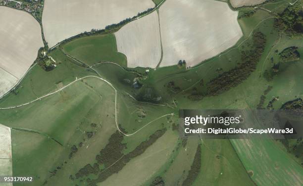 This is DigitalGlobe via Getty Images Satellite imagery of The Long Man of Wilmington - a hill figure on the steep slopes of Windover Hill near...