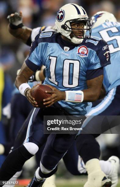 Vince Young of the Tennessee Titans rolls out looking to pass against the San Diego Chargers on December 25, 2009 at LP Field in Nashville, Tennessee.