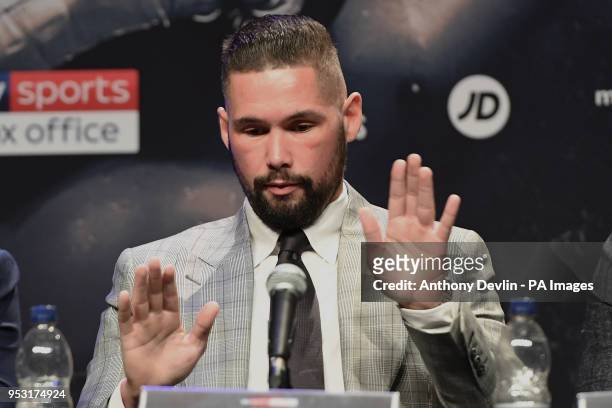 Tony Bellew makes a polishing gesture as he makes reference to the 1980s film the Karate Kid during the press conference at the Echo Arena, Liverpool.