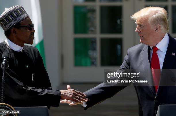 President Donald Trump and Nigerian President Muhammadu Buhari shake hands during a joint press conference in the Rose Garden of the White House...