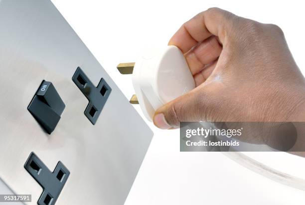 plugging in - electrical plug stock pictures, royalty-free photos & images