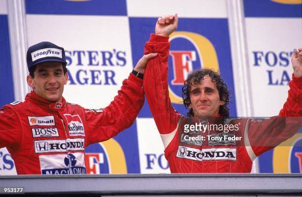 McLaren Honda driver Alain Prost of France celebrates his victory with team-mate Ayrton Senna of Brazil who finished second after the Australian...