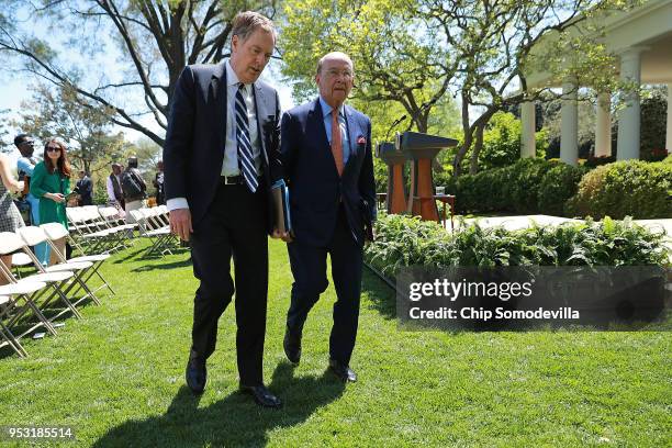 Trade Representative Robert Lighthizer and Commerce Secretary Wilbur Ross leave the Rose Garden following a joint news conference with President...