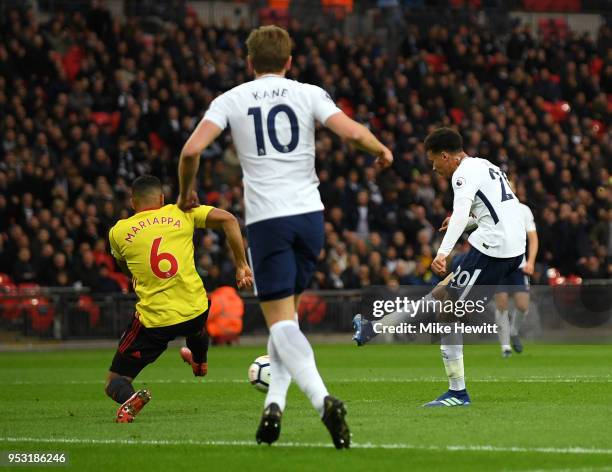 Dele Alli of Tottenham Hotspur shoots and scores his side's first goal during the Premier League match between Tottenham Hotspur and Watford at...