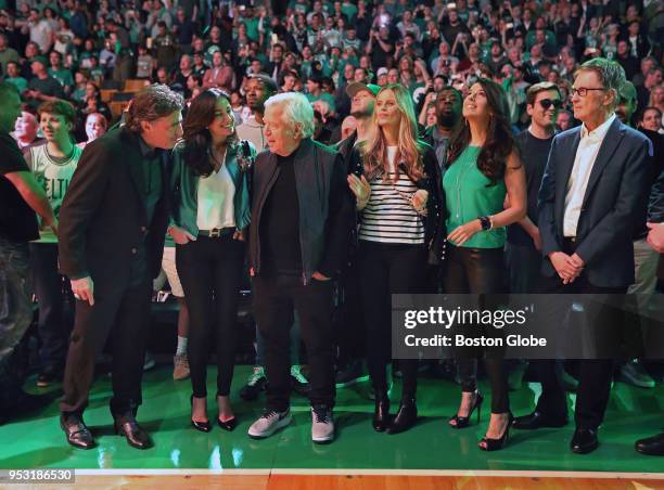 Pictured together bathed in some of the green lighting used during pre game player introductions and ceremonies are Boston Celtics owner Wyc...