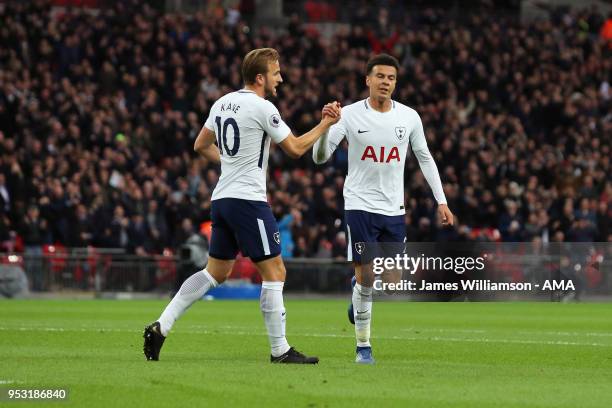 Dele Alli of Tottenham celebrates with Harry Kane of Tottenham after scoring a goal to make it 1-0 during the Premier League match between Tottenham...