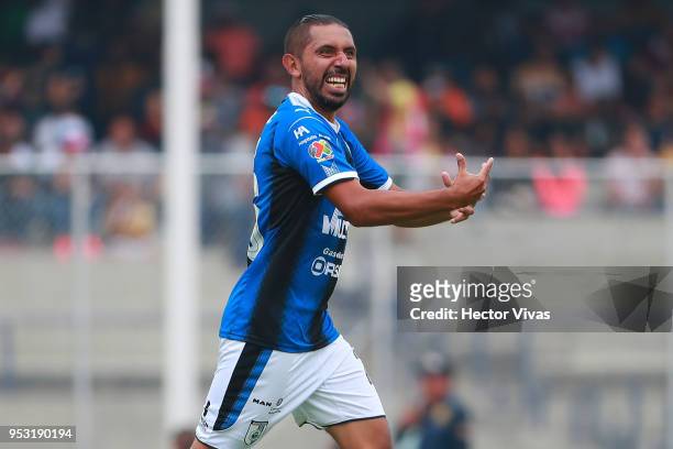 Erbin Trejo of Queretaro celebrates after scoring the first goal of his team during the 17th round match between Pumas UNAM and Queretaro as part of...
