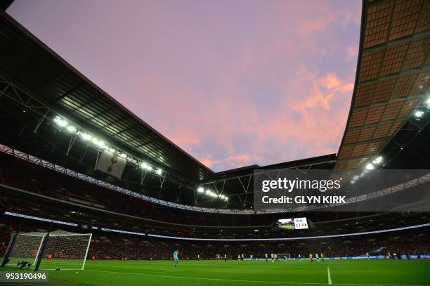 General view of the stadium at sunset is seen during the English Premier League football match between Tottenham Hotspur and Watford at Wembley...