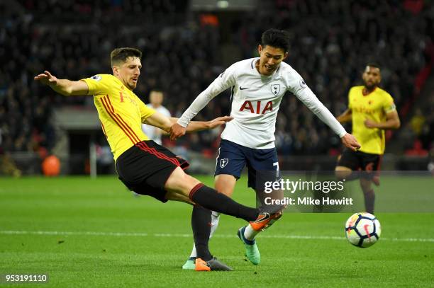 Craig Cathcart of Watford and Heung-Min Son of Tottenham Hotspur in action during the Premier League match between Tottenham Hotspur and Watford at...