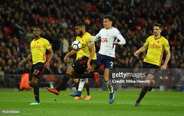 Adrian Mariappa of Watford and Dele Alli of Tottenham Hotspur clash during the Premier League match between Tottenham Hotspur and Watford at Wembley...