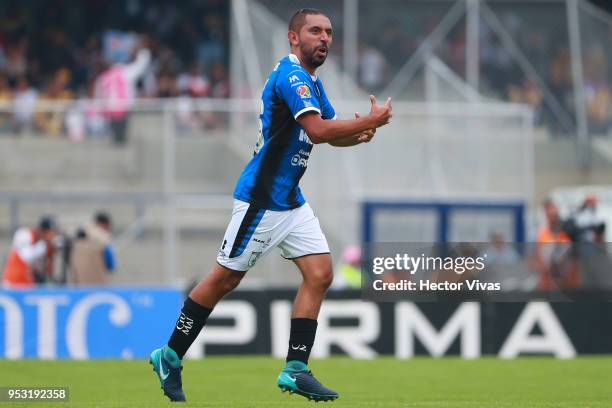 Erbin Trejo of Queretaro celebrates after scoring the first goal of his team during the 17th round match between Pumas UNAM and Queretaro as part of...