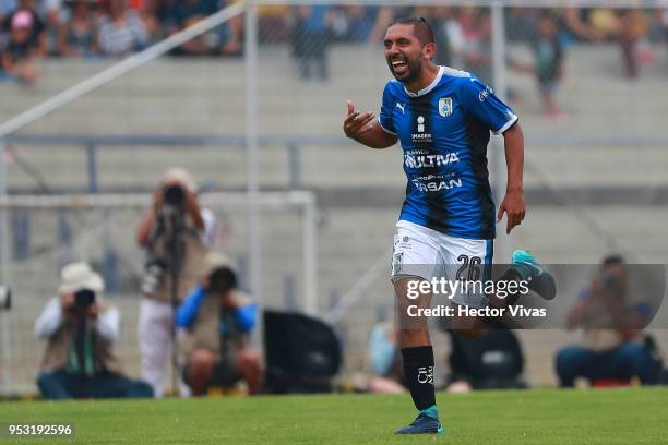 Erbin Trejo of Queretaro celebrates after scoring the first goal of his team during the 17th round match between Pumas UNAM and Queretaro as part of...