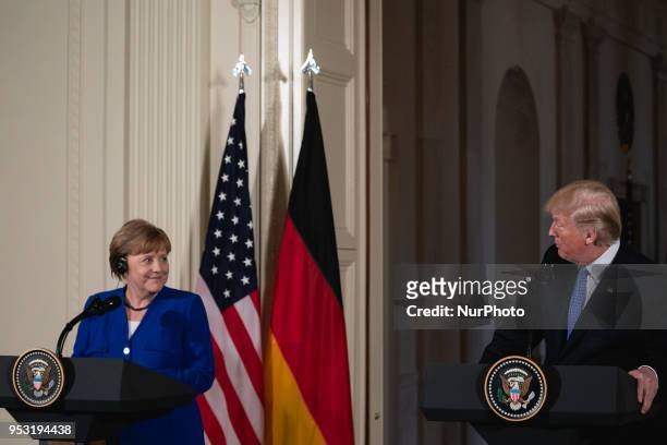 President Donald Trump , and Germany's Chancellor Angela Merkel hold a joint press conference in the East Room of the White House in Washington,...