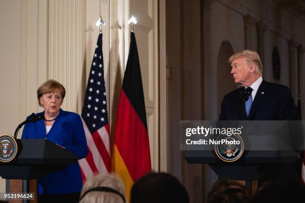 President Donald Trump , and Germany's Chancellor Angela Merkel hold a joint press conference in the East Room of the White House in Washington,...