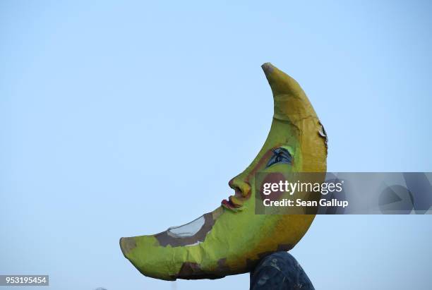 An artist dressed as the moon performs at Mauerpark on Walpurgis night on April 30, 2018 in Berlin, Germany. Walpurgis is traditionally the night of...