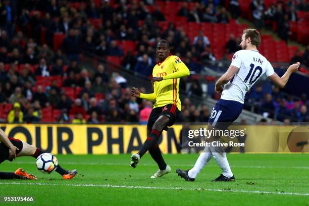 Harry Kane of Tottenham Hotspur shoots and scores his side's second goal during the Premier League match between Tottenham Hotspur and Watford at...