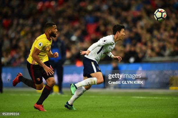 Tottenham Hotspur's South Korean striker Son Heung-Min vies with Watford's English-born Jamaican defender Adrian Mariappa during the English Premier...